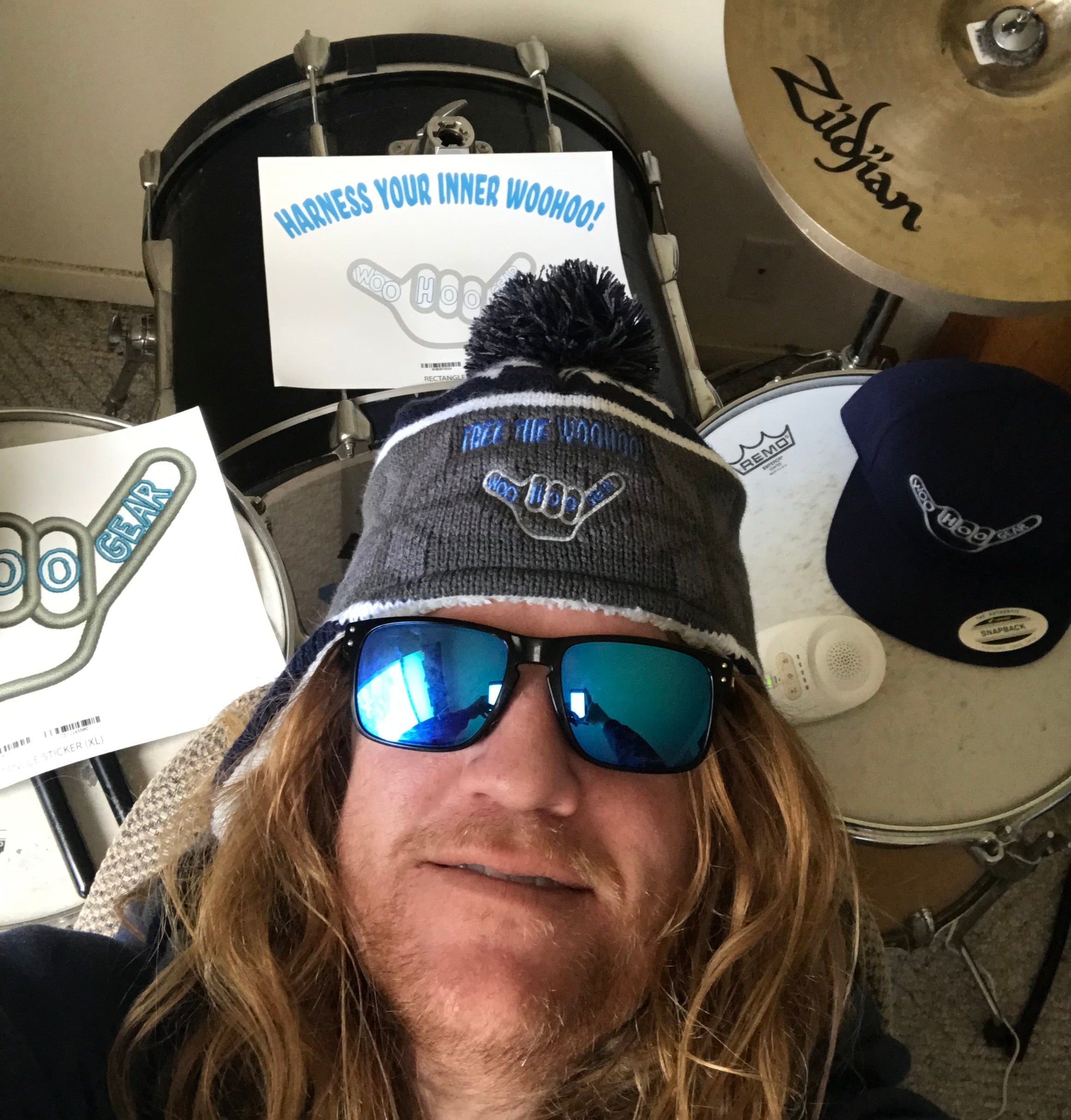 WOOHOO Gear stickers and hats on a drumset